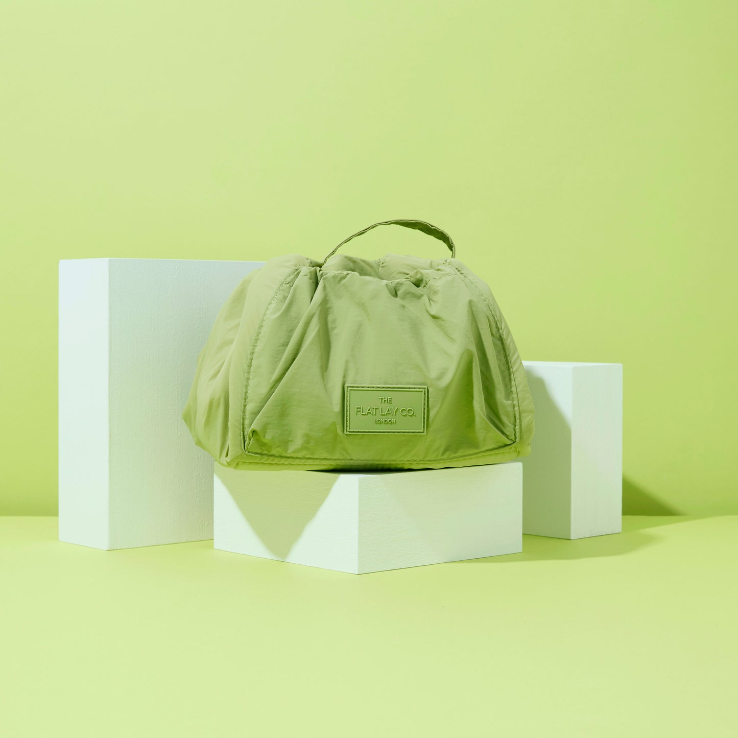 The Flat Lay Co. Drawstring Makeup Bag in Light Green Parachute