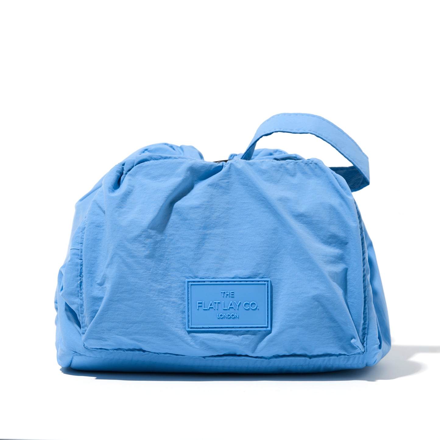The Flat Lay Co. Drawstring Makeup Bag in Blue Parachute